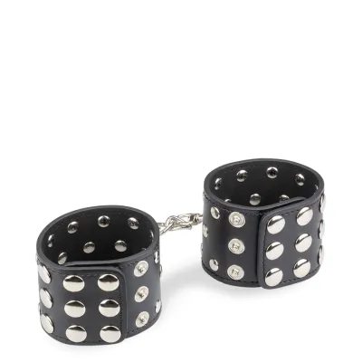 Menottes poignets cuir noir rivets